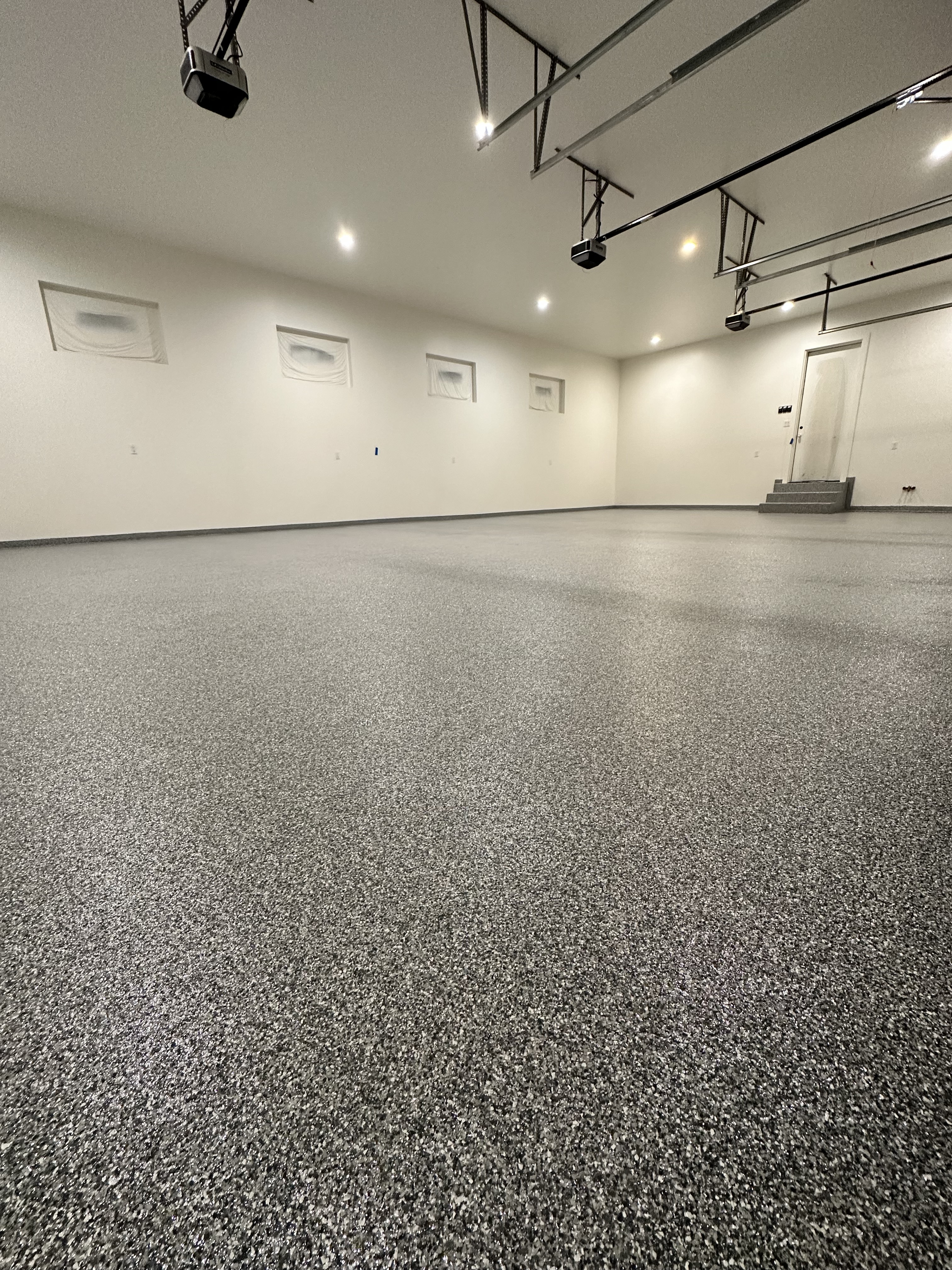 Residential garage with charcoal flake floor
