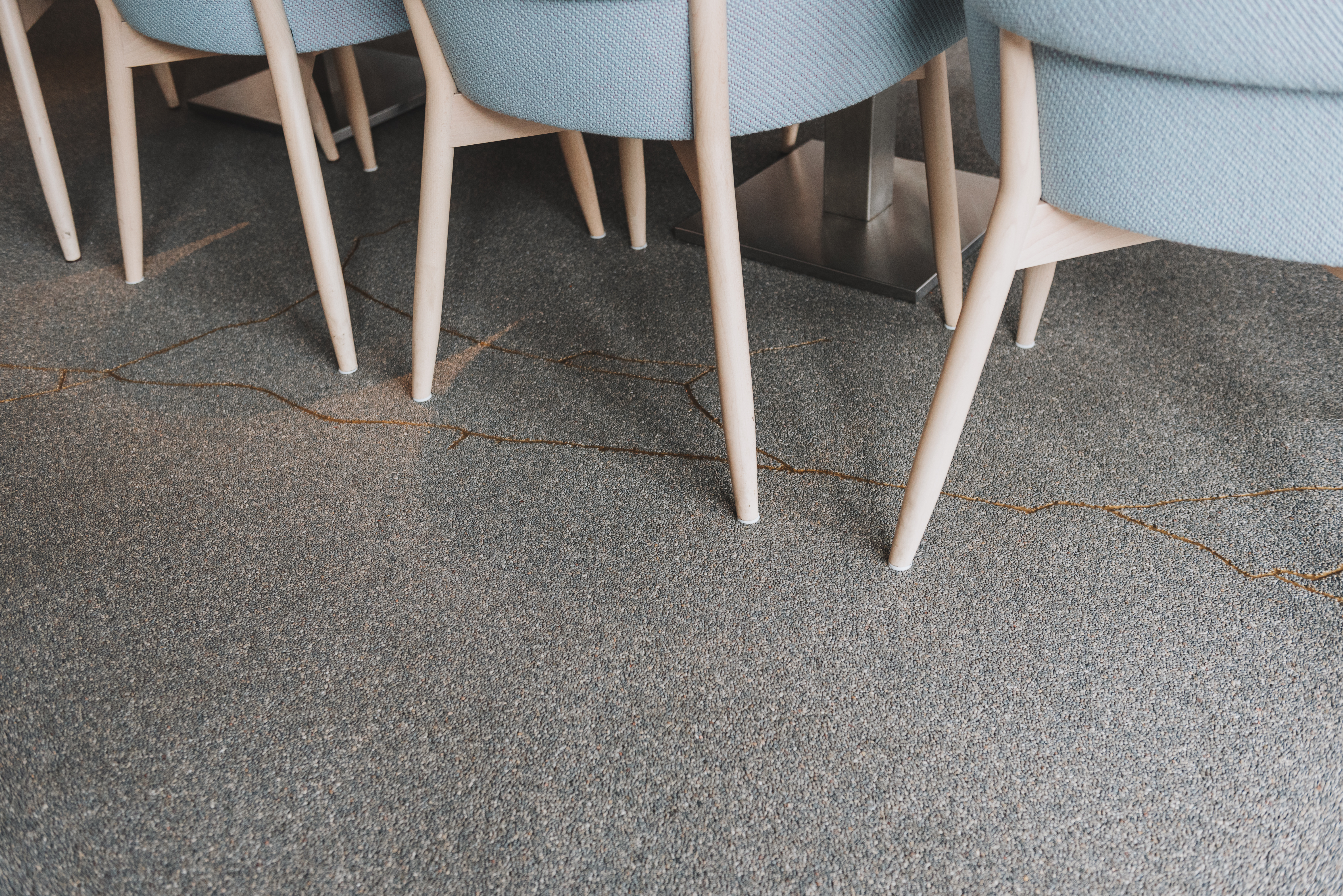 Retail cafe interior with tan flake floor